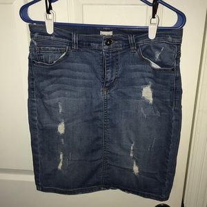 Distressed denim skirt.